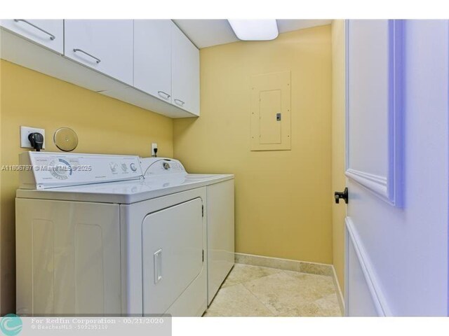 2100 N Ocean Blvd Unit 5B, Fort Lauderdale, FL 33305 - laundry room featuring independent washer and dryer, cabinet space, electric panel, and baseboards