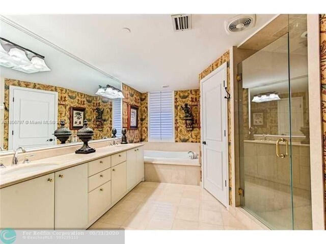 2100 N Ocean Blvd Unit 5B, Fort Lauderdale, FL 33305 - bathroom with a shower stall, wallpapered walls, a garden tub, double vanity, and tile patterned floors