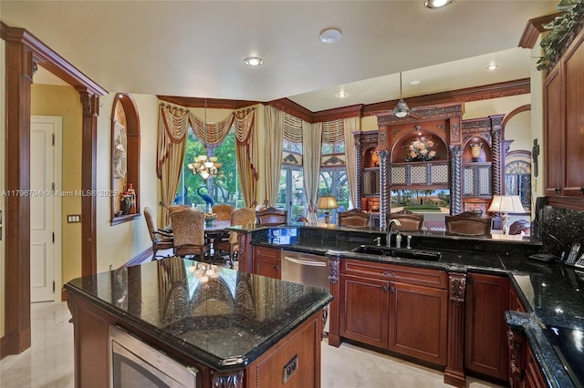 10233 NW 66th Dr, Parkland, FL 33076 - kitchen featuring a sink, stainless steel microwave, dark stone counters, a peninsula, and recessed lighting