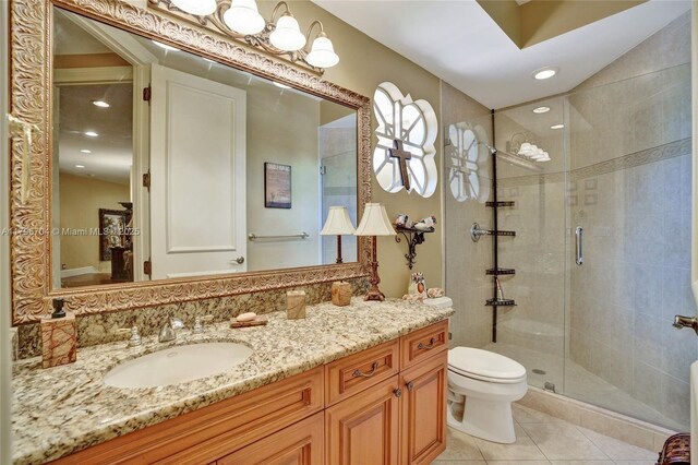 10233 NW 66th Dr, Parkland, FL 33076 - bathroom with a shower stall, tile patterned floors, vanity, toilet, and recessed lighting