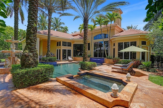 10233 NW 66th Dr, Parkland, FL 33076 - outdoor pool with an in-ground hot tub and a patio area