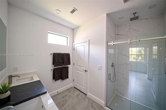 2022 Granada Rd, La Belle, FL 33935 - bathroom featuring a marble finish shower, marble finish floors, baseboards, and double vanity
