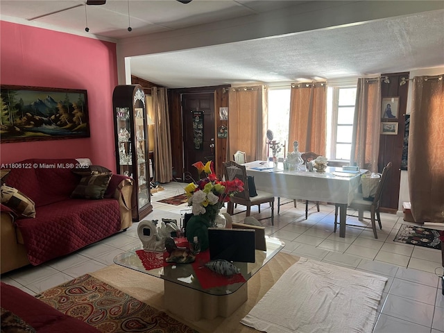 1527 NW 101st St, Miami, FL 33147 - living area featuring ceiling fan, light tile patterned floors, and a textured ceiling