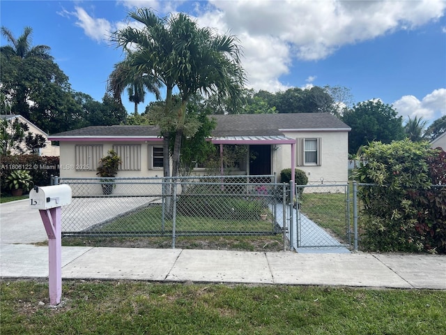 1527 NW 101st St, Miami, FL 33147 - view of front of home featuring a gate, stucco siding, and a shingled roof