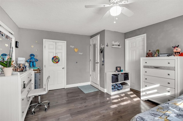 114 Marion Rd, West Park, FL 33023 - bedroom featuring dark wood finished floors, a textured ceiling, baseboards, and ceiling fan