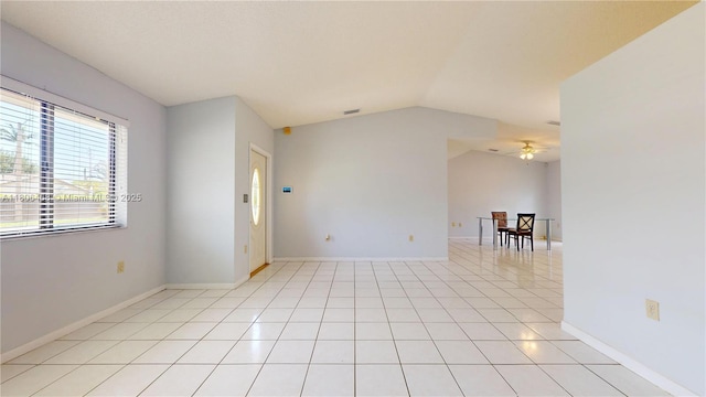 9936 SW 155th St, Miami, FL 33157 - spare room featuring vaulted ceiling, a ceiling fan, light tile patterned floors, and baseboards