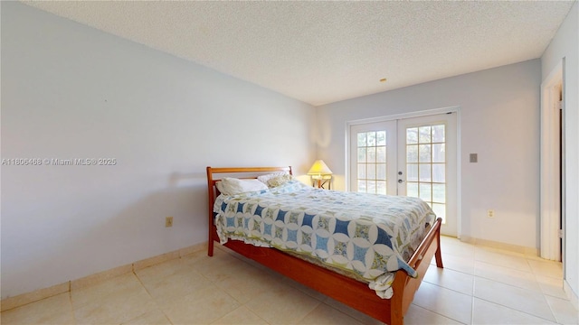 9936 SW 155th St, Miami, FL 33157 - bedroom with french doors, access to outside, a textured ceiling, baseboards, and light tile patterned floors
