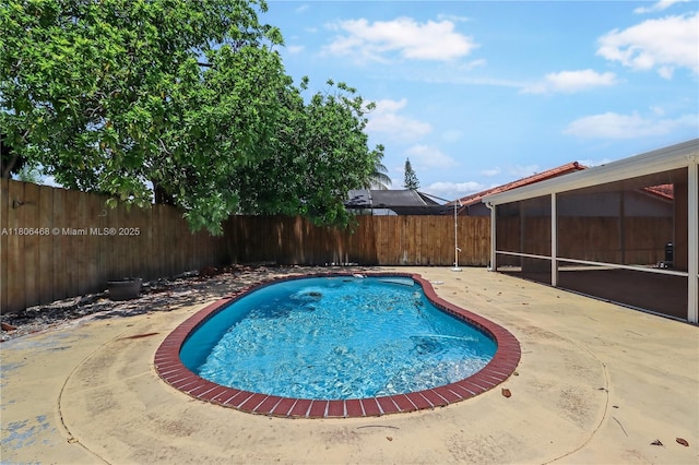 9936 SW 155th St, Miami, FL 33157 - view of pool featuring a sunroom, a fenced backyard, and a patio area