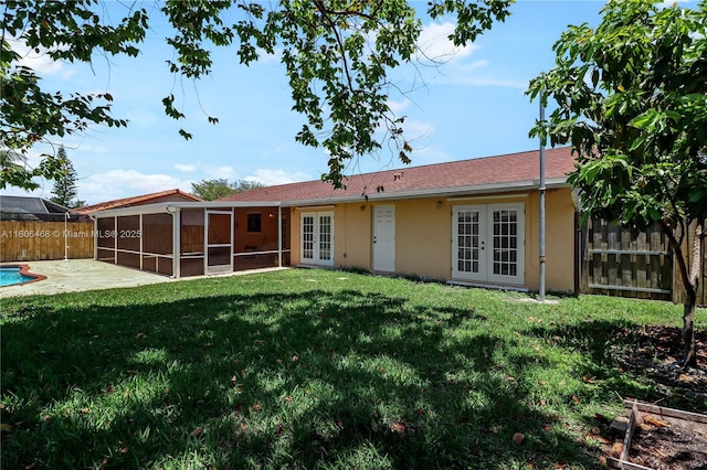 9936 SW 155th St, Miami, FL 33157 - rear view of house featuring french doors, a sunroom, stucco siding, and a patio