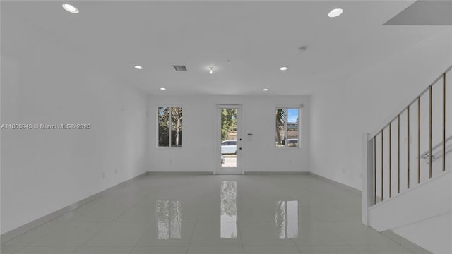 2621 NE 212th Ter Unit 209, Miami, FL 33180 - unfurnished room with stairs, recessed lighting, tile patterned flooring, and baseboards