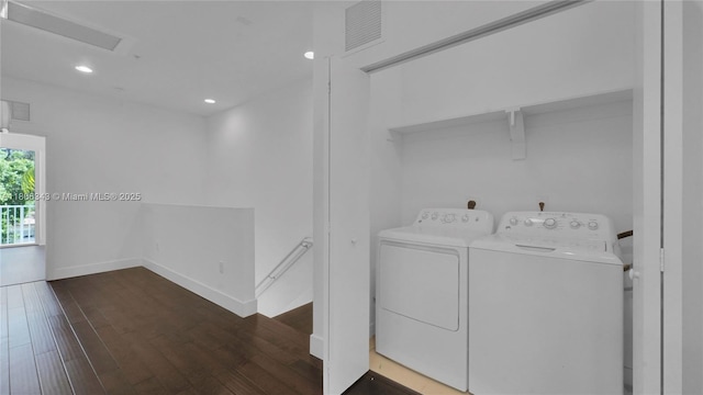 2621 NE 212th Ter Unit 209, Miami, FL 33180 - laundry room featuring washing machine and clothes dryer, wood finished floors, recessed lighting, and baseboards