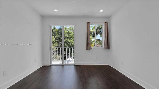 2621 NE 212th Ter Unit 209, Miami, FL 33180 - spare room with baseboards, dark wood-type flooring, and recessed lighting