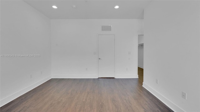2621 NE 212th Ter Unit 209, Miami, FL 33180 - spare room featuring baseboards, dark wood-type flooring, and recessed lighting