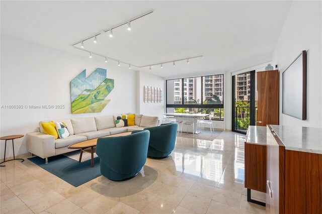 520 Brickell Key Dr Unit A604, Miami, FL 33131 - living area featuring track lighting and expansive windows