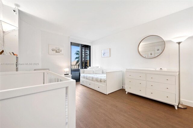 520 Brickell Key Dr Unit A604, Miami, FL 33131 - bedroom with wood finished floors and baseboards