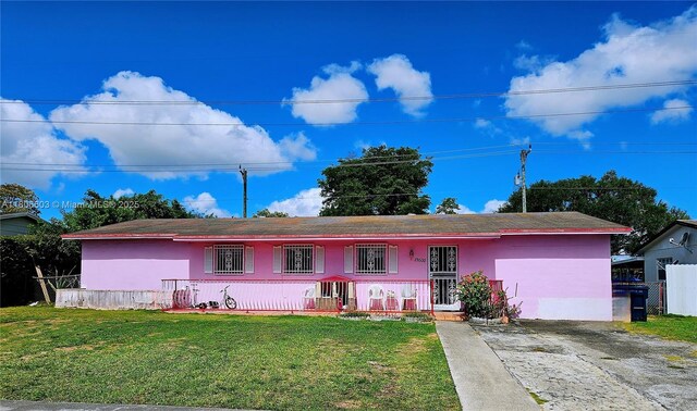 15600 SW 106th Ave, Miami, FL 33157 - ranch-style home featuring covered porch, a front yard, and stucco siding