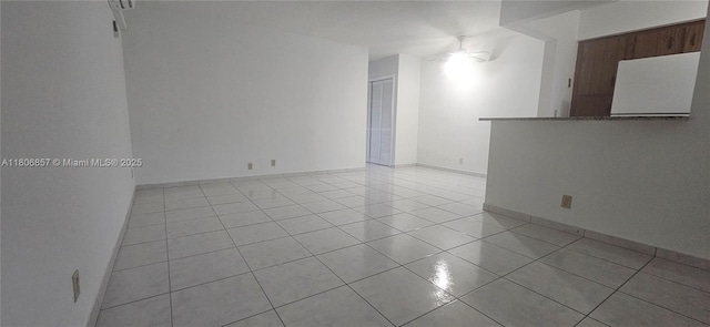 141 NE 10th Ave Unit 22C, Hallandale Beach, FL 33009 - empty room with light tile patterned floors and a ceiling fan