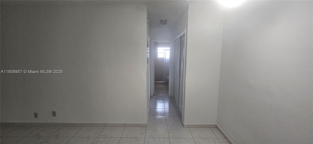 141 NE 10th Ave Unit 22C, Hallandale Beach, FL 33009 - hall featuring light tile patterned flooring and baseboards