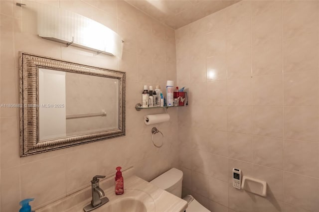 5514 SW 44th Ter, Dania Beach, FL 33314 - bathroom featuring toilet, tile walls, and a sink