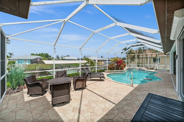 249 SW 37th Ln, Cape Coral, FL 33914 - view of pool featuring a patio area, a pool with connected hot tub, and glass enclosure