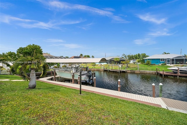 249 SW 37th Ln, Cape Coral, FL 33914 - dock area featuring boat lift, a water view, and a lawn