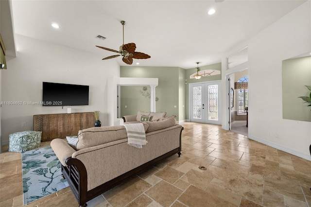 249 SW 37th Ln, Cape Coral, FL 33914 - living room with baseboards, stone tile floors, recessed lighting, ceiling fan, and french doors