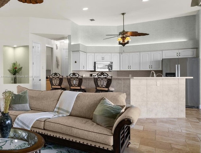 249 SW 37th Ln, Cape Coral, FL 33914 - living area featuring stone tile floors, ceiling fan, and recessed lighting