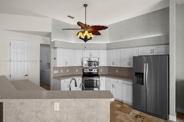 249 SW 37th Ln, Cape Coral, FL 33914 - kitchen featuring stainless steel appliances, ceiling fan, white cabinets, tasteful backsplash, and washer / clothes dryer