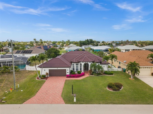 249 SW 37th Ln, Cape Coral, FL 33914 - mediterranean / spanish home featuring a garage, driveway, a residential view, a tiled roof, and stucco siding