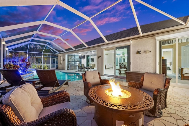 249 SW 37th Ln, Cape Coral, FL 33914 - view of patio / terrace featuring a fire pit, an outdoor pool, and glass enclosure