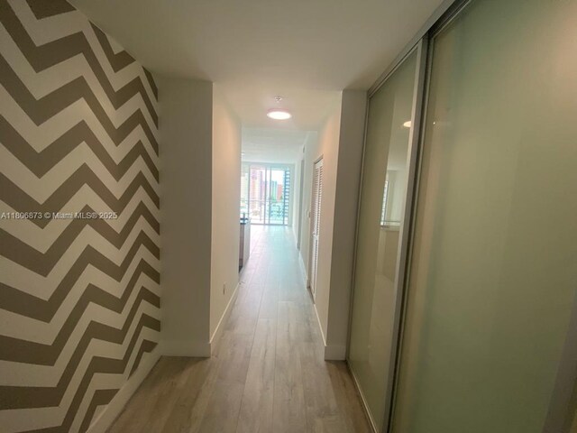 1111 SW 1st Ave Unit 2217-N, Miami, FL 33130 - hallway with light wood finished floors and baseboards