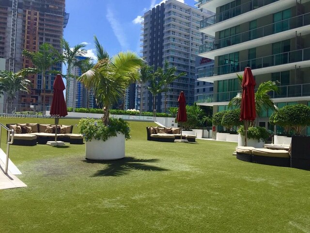 1111 SW 1st Ave Unit 2217-N, Miami, FL 33130 - view of property's community featuring an outdoor hangout area, a view of city, and a lawn