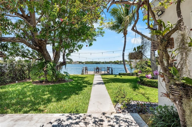 1241 Stillwater Dr, Miami Beach, FL 33141 - dock area featuring a lawn and a water view