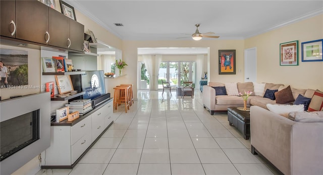 1241 Stillwater Dr, Miami Beach, FL 33141 - living room with crown molding, light tile patterned floors, and a ceiling fan