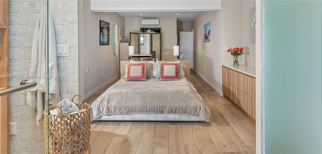 1241 Stillwater Dr, Miami Beach, FL 33141 - bedroom with light wood-type flooring and baseboards