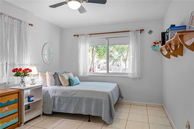 1241 Stillwater Dr, Miami Beach, FL 33141 - tiled bedroom featuring baseboards and ceiling fan