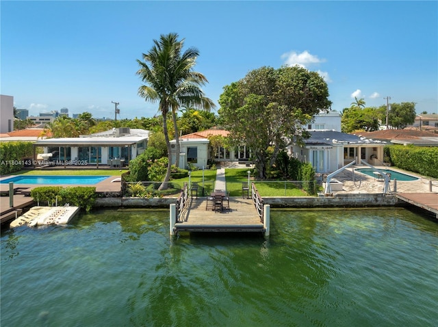 1241 Stillwater Dr, Miami Beach, FL 33141 - dock area with an outdoor pool, a patio area, and a water view
