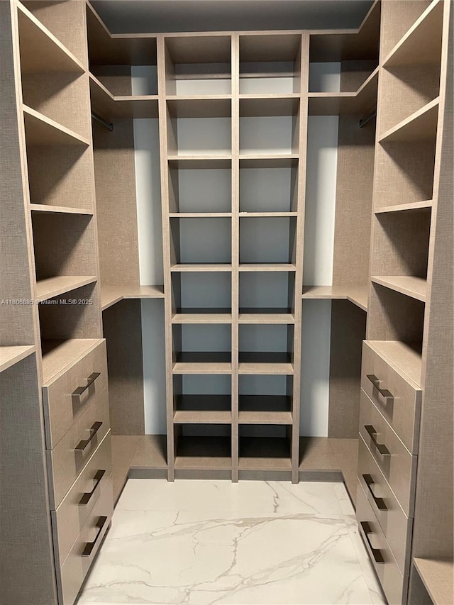 15701 Collins Ave Unit 1603, Sunny Isles Beach, FL 33160 - spacious closet featuring marble look tiles