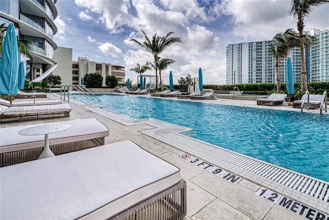 15701 Collins Ave Unit 1603, Sunny Isles Beach, FL 33160 - community pool featuring a patio