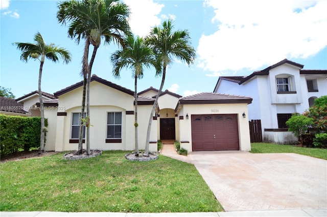 14226 SW 90th Ter, Miami, FL 33186 - view of front of house with an attached garage, concrete driveway, stucco siding, a front lawn, and a tile roof