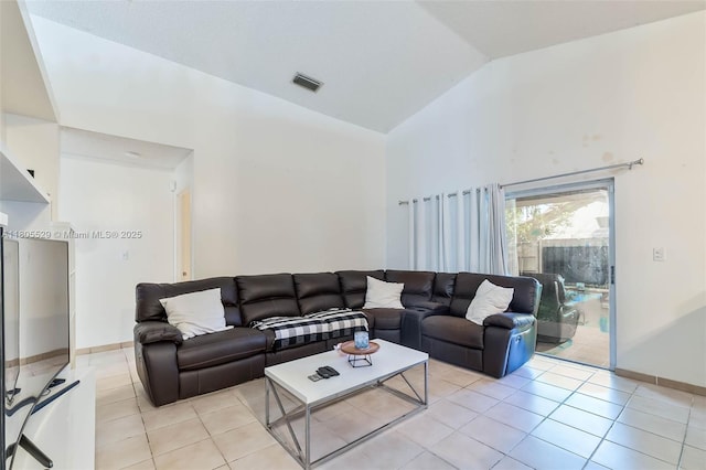 14226 SW 90th Ter, Miami, FL 33186 - living room with high vaulted ceiling, light tile patterned floors, and baseboards