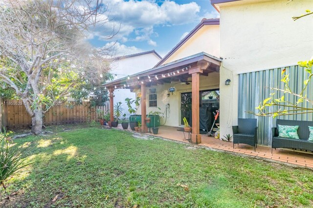 14226 SW 90th Ter, Miami, FL 33186 - view of yard with a ceiling fan and a patio area