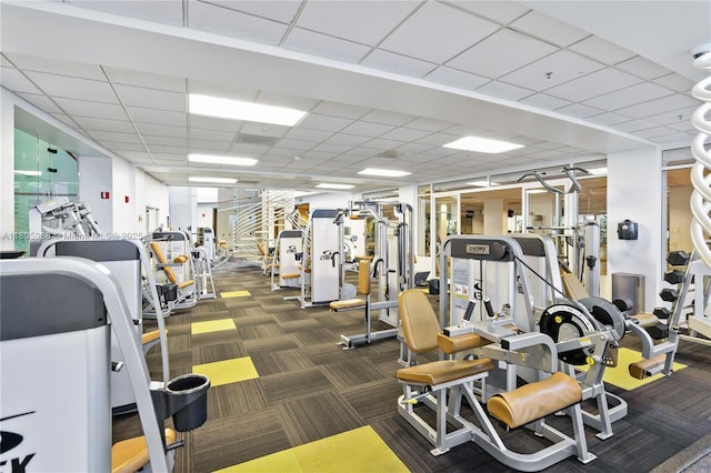 848 Brickell Key Dr Unit 3803, Miami, FL 33131 - workout area featuring carpet floors and a paneled ceiling