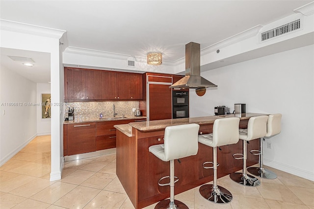 1850 S Ocean Dr Unit 1105, Hallandale Beach, FL 33009 - kitchen with island range hood, a sink, baseboards, decorative backsplash, and a peninsula