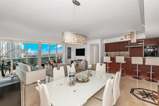 1850 S Ocean Dr Unit 1105, Hallandale Beach, FL 33009 - dining space featuring floor to ceiling windows, light tile patterned floors, and crown molding
