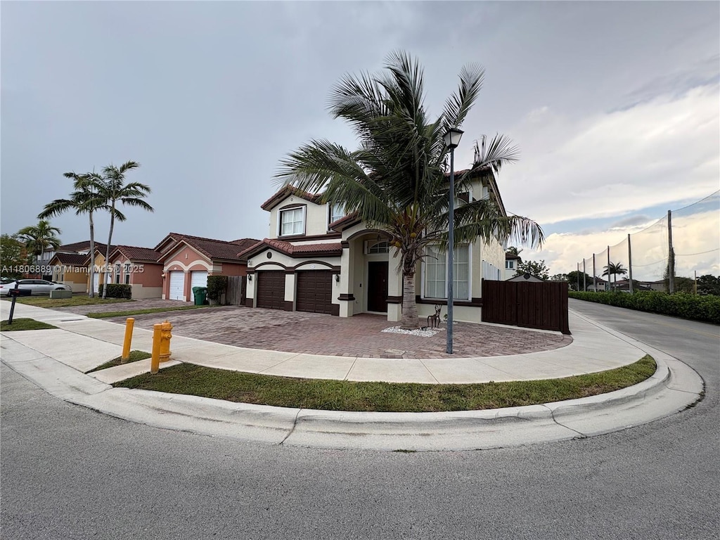 15375 SW 93rd Ln, Miami, FL 33196 - view of front of property with a garage, decorative driveway, and stucco siding