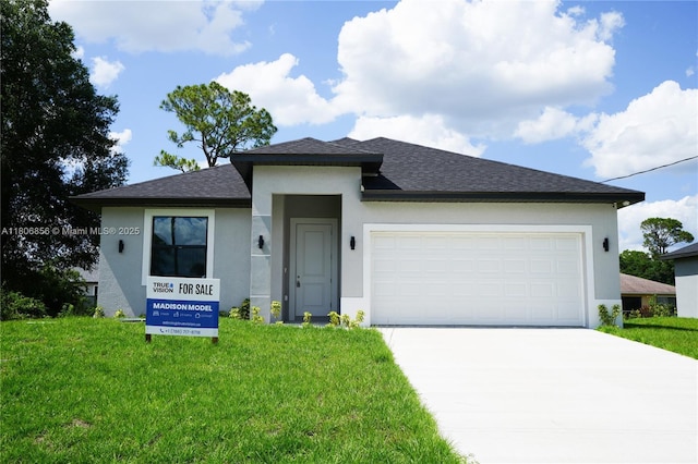 2006 Hercules Rd, La Belle, FL 33935 - view of front of house with stucco siding, concrete driveway, a front lawn, a garage, and roof with shingles