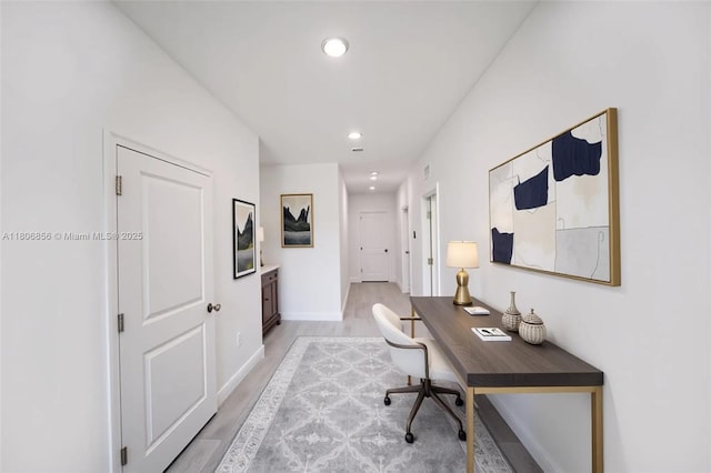 2006 Hercules Rd, La Belle, FL 33935 - home office with light wood-style flooring, recessed lighting, and baseboards