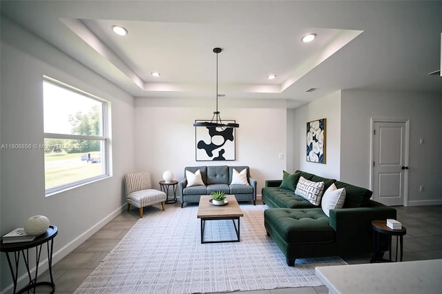 2006 Hercules Rd, La Belle, FL 33935 - living room with a raised ceiling, baseboards, and recessed lighting