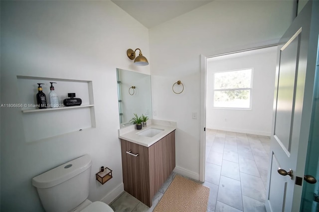 2006 Hercules Rd, La Belle, FL 33935 - bathroom featuring vanity, toilet, and tile patterned floors